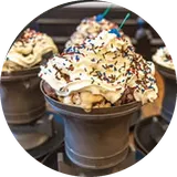 Brooker's ice cream sundae topped with whipped cream and sprinkles